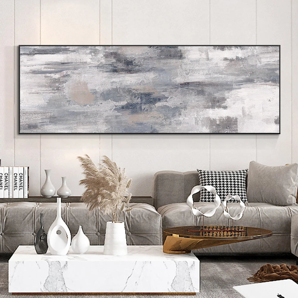 Modern living room with abstract art, sofa, and decorative items.