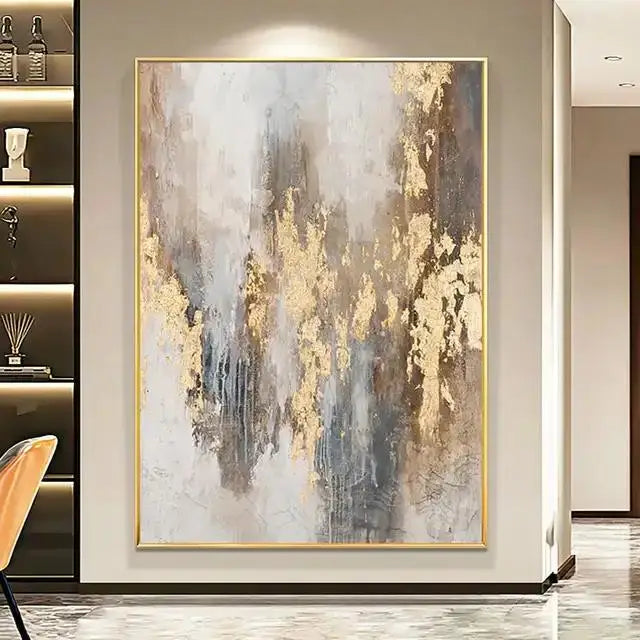 Abstract art painting with gold and gray tones in a modern interior setting.