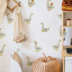 Children's room with duck-themed wallpaper, wicker basket, and wooden shelf.