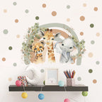 Decorative wall with animal-themed wall art, shelf, and colorful polka dots.