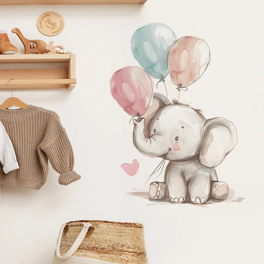 Wall decal of an elephant holding balloons on a wall with a sweater and bag below.