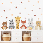 Children's room with animal-themed wall stickers on a white wall with polka dots.