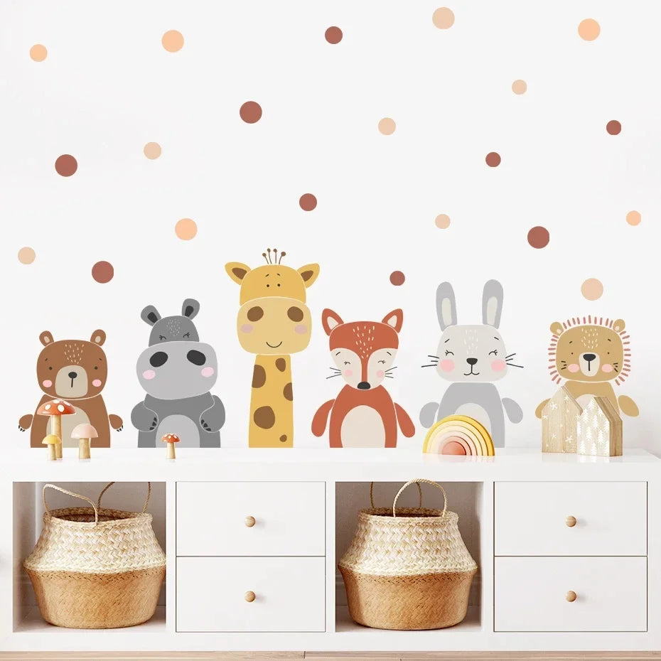 Children's room with animal-themed wall stickers on a white wall with polka dots.