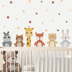 Children's room with animal-themed wall stickers on a polka dot wall.