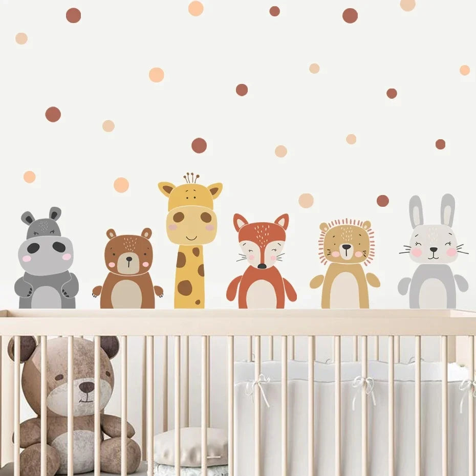 Children's room with animal-themed wall stickers on a polka dot wall.