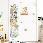 Wall decal with cartoon animals on a white wall in a room.
