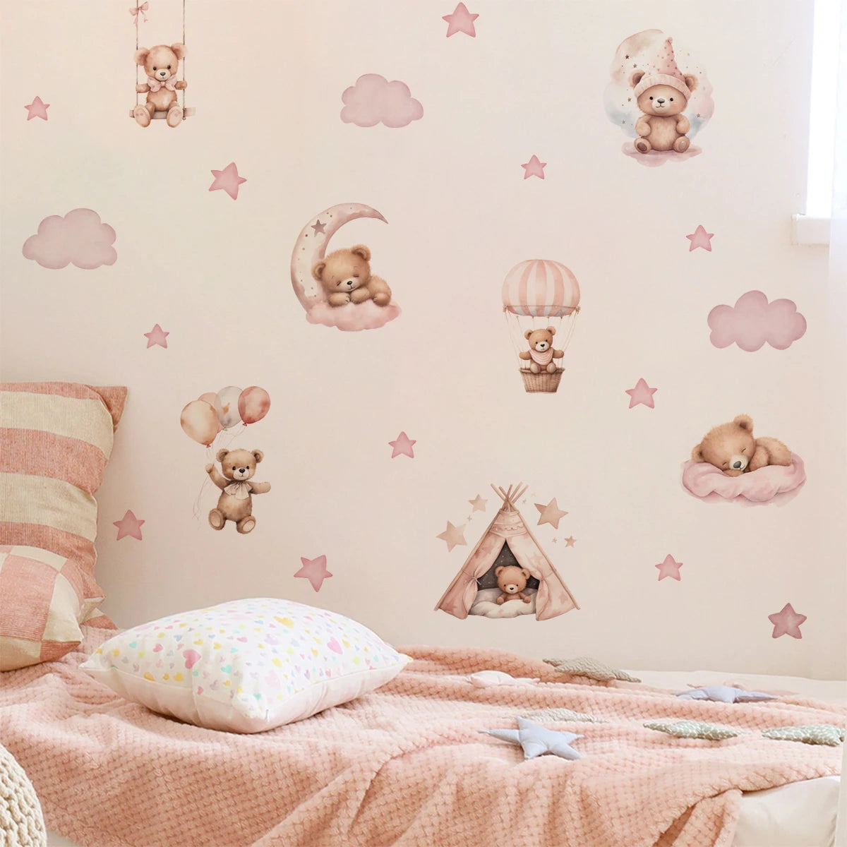 Children's room with teddy bear wall decals on a light pink wall.