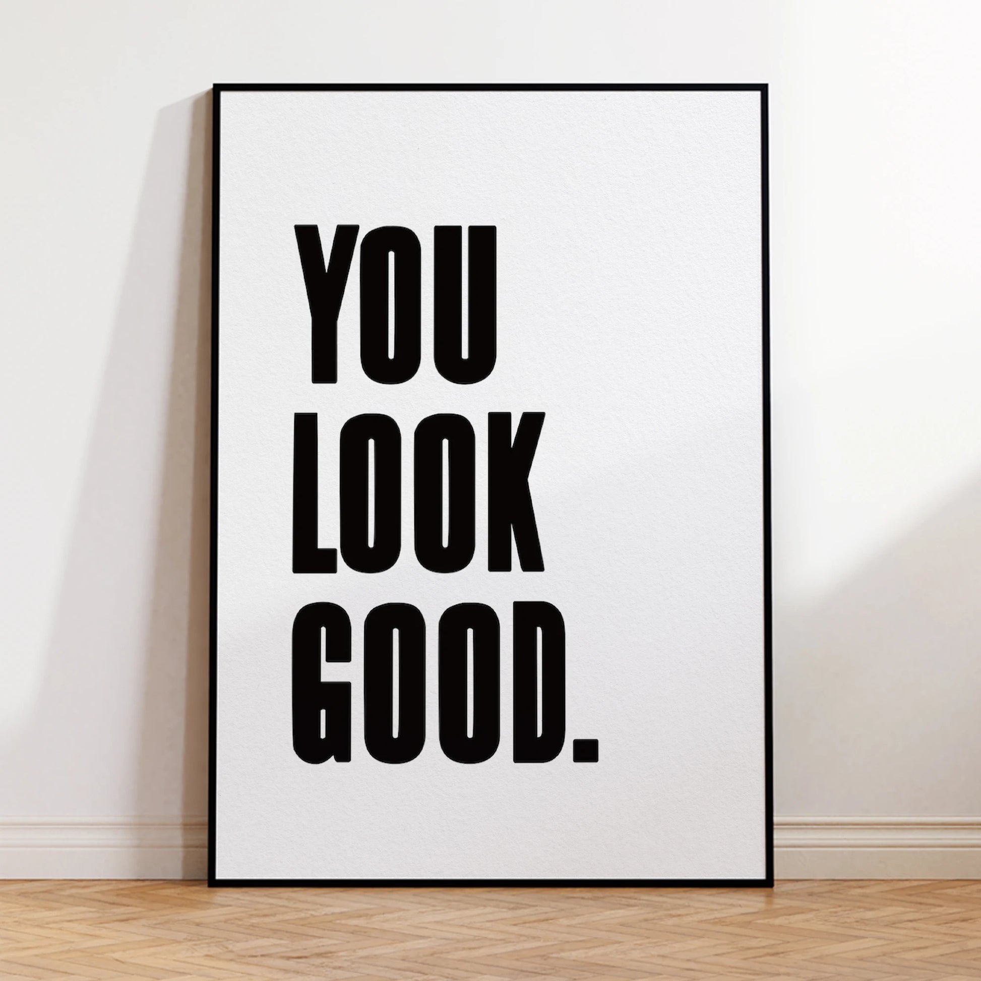 Framed poster with 'YOU LOOK GOOD.' text on a white background