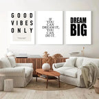 Living room with motivational wall art and white furniture