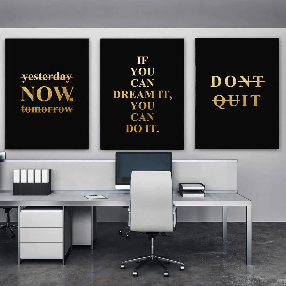 Modern office setup with motivational posters on a wall.