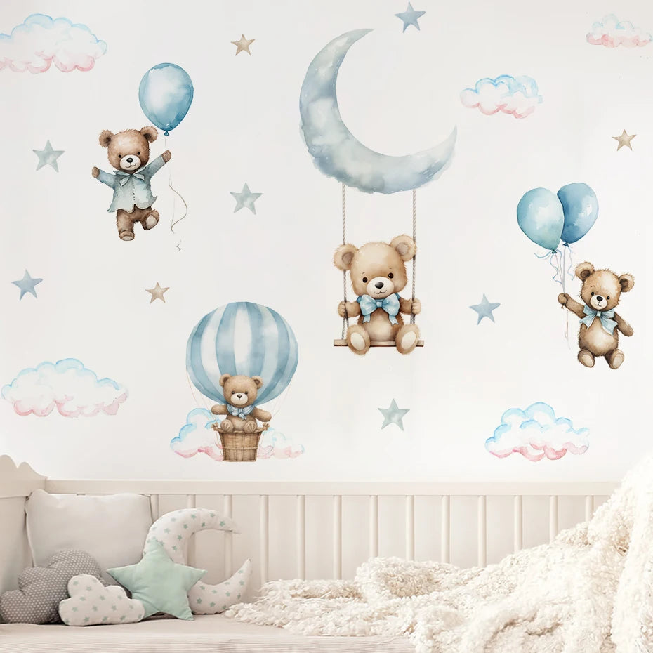 Wall stickers with teddy bears, balloons, and a moon on a light-colored wall.