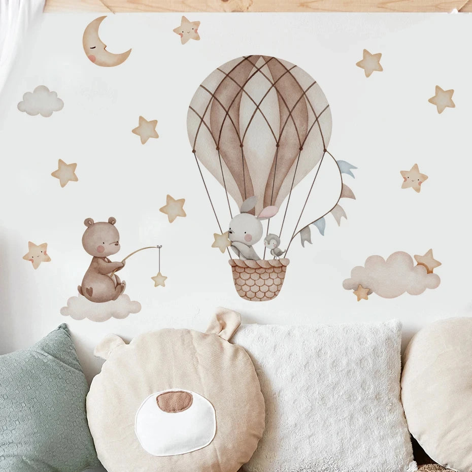 Children's room decor with a hot air balloon, clouds, and animals on a white background.
