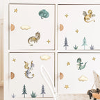 Children's room with dragon and nature-themed wall stickers on a white cabinet.