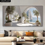 A framed wall art print showing a bright coastal archway scene with potted trees and a blue sea, displayed above a beige sofa in a modern living room. 
