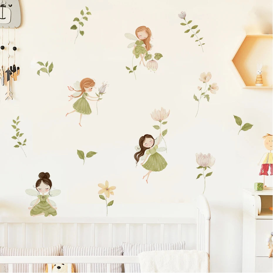 Wall with fairy and flower decals on a light-colored wall.