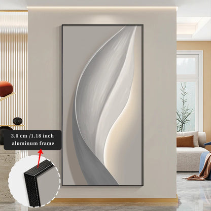 Abstract wall art with a thin black frame in a modern living room setting.