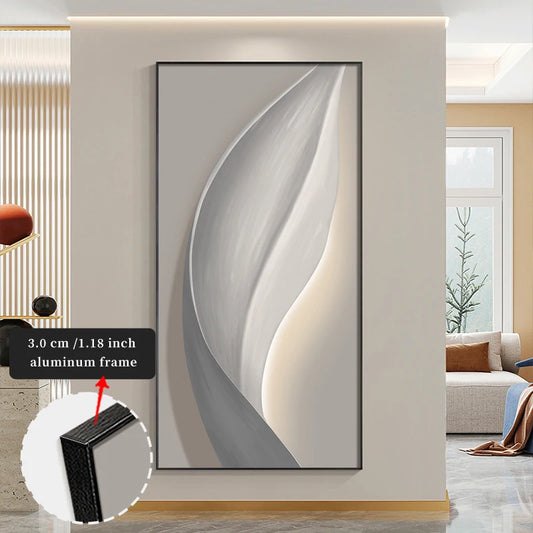 Abstract wall art with a thin black frame in a modern living room setting.