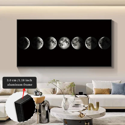 Wall art displaying moon phases in a modern living room.