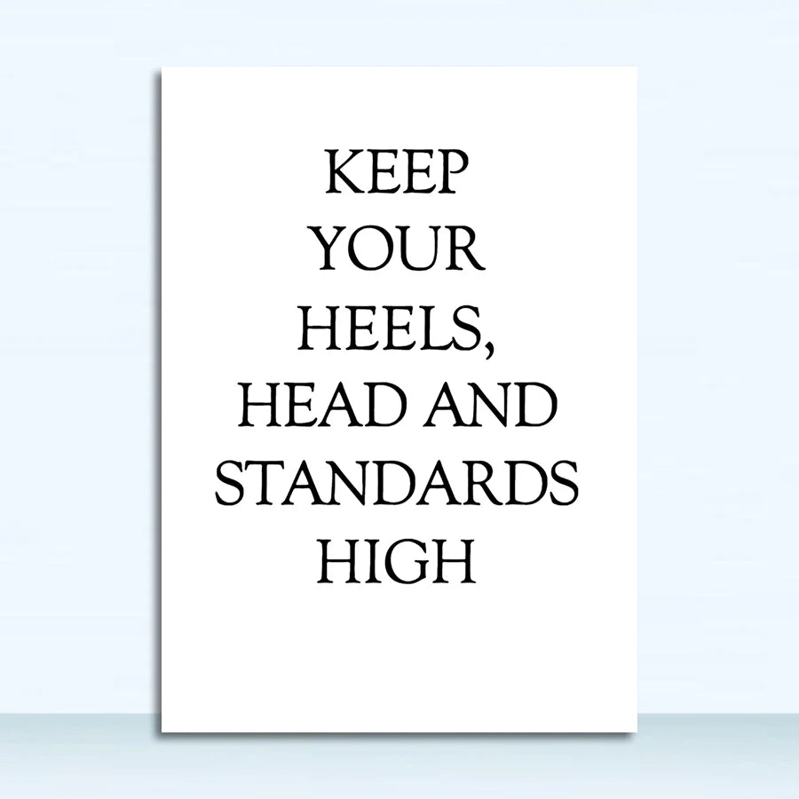 Motivational poster with text 'KEEP YOUR HEELS, HEAD AND STANDARDS HIGH' on a white background.