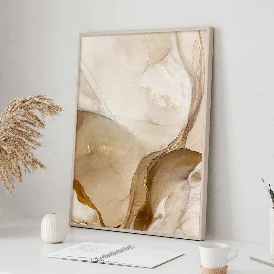 Abstract art piece in a neutral color palette on a wall with decor items below.