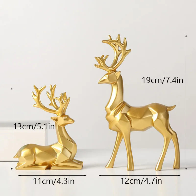Two gold deer figurines with measurements on a white background