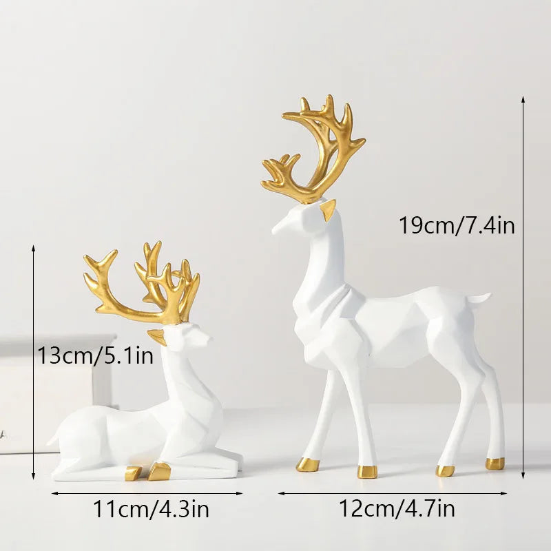 White deer figurines with gold antlers and measurements on a light gray background