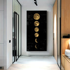 Modern interior hallway with a vertical wall art piece depicting moon phases.