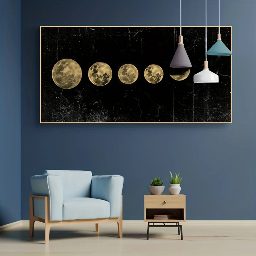 Modern interior with a blue armchair, side table, and wall art depicting moon phases.