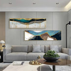 Modern living room with gray sofa, abstract wall art, and decorative items.