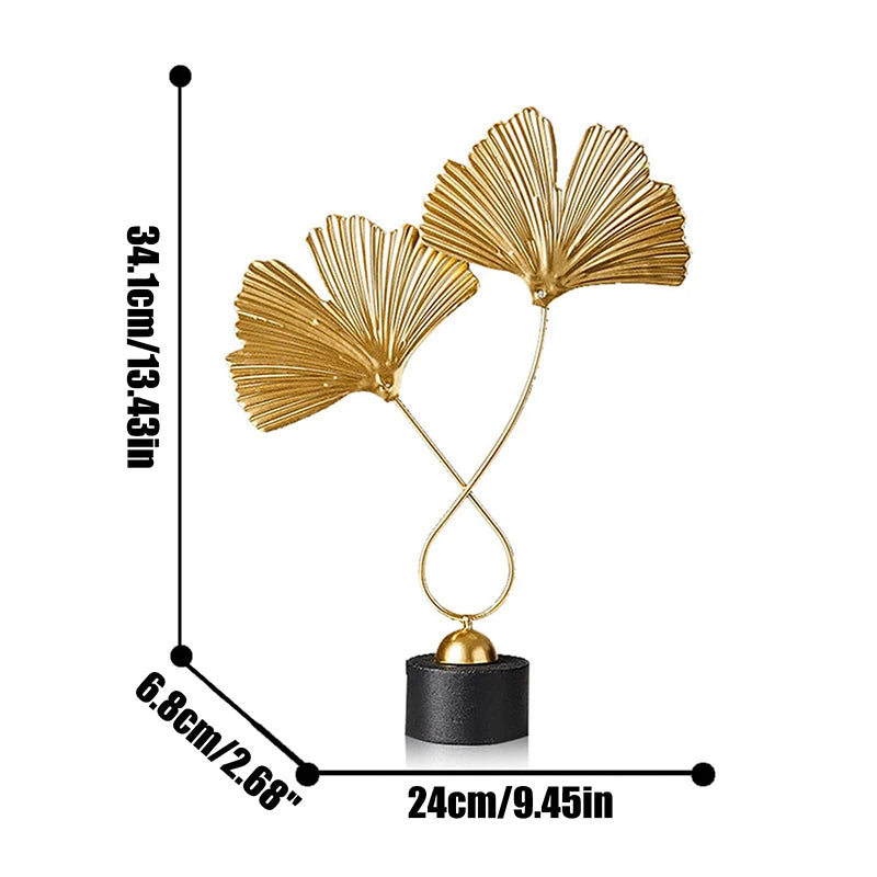 Decorative gold leaf sculpture with measurements on a white background