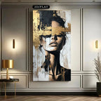 Abstract art of a woman's face on a wall in a modern interior setting