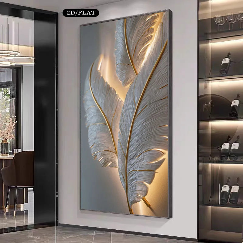 A large vertical wall art piece featuring two illuminated white feathers with gold lines on a gray background, displayed in a modern interior setting next to a glass wine cabinet.