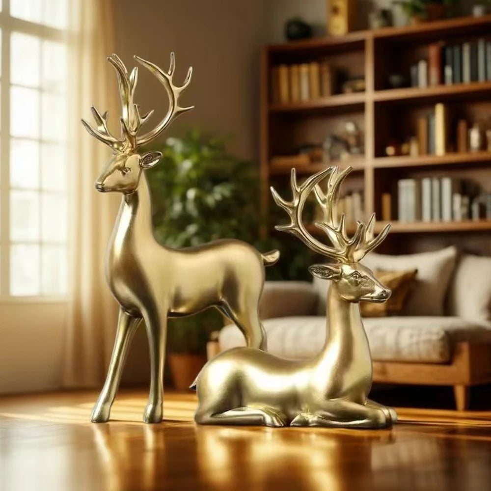Gold deer figurines on a wooden surface with a cozy living room background