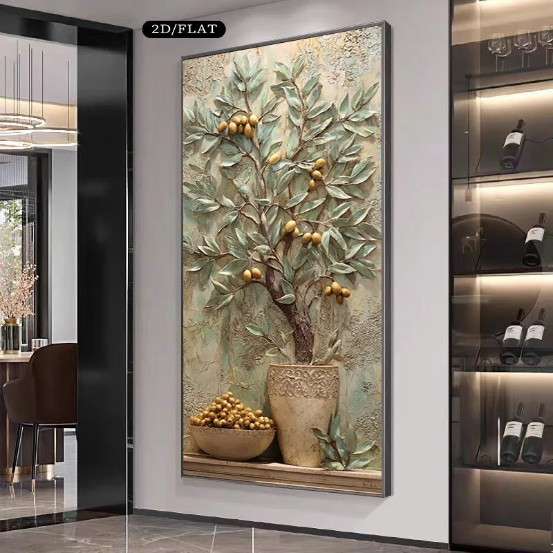 A large framed wall art piece featuring a 3D textured olive tree with gold olives in a pot, displayed in a modern interior setting.