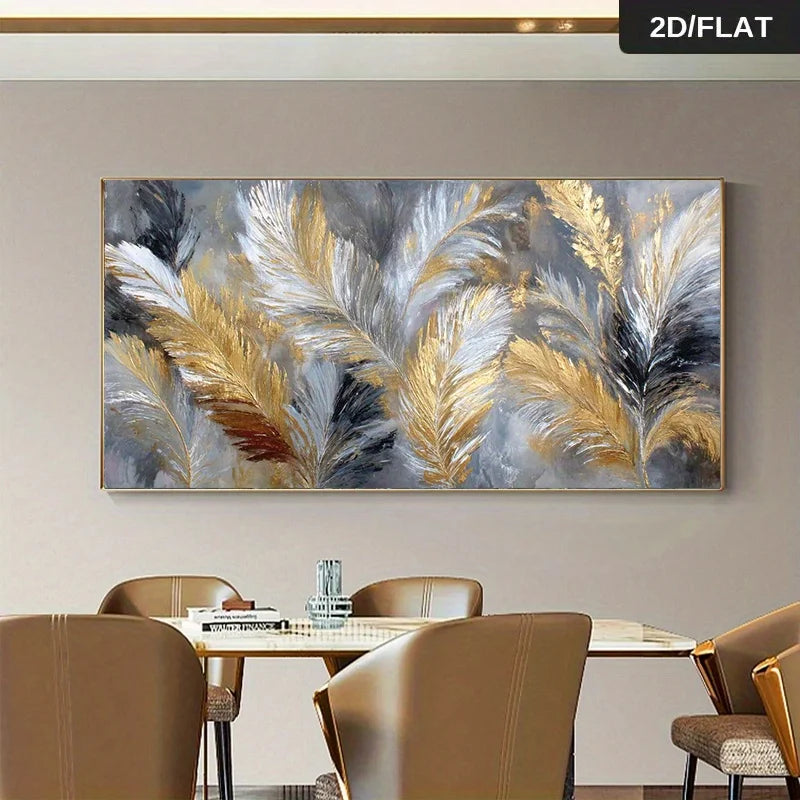 A large rectangular wall art print featuring abstract pampas grass feathers in gold, white, gray, and black, displayed above a dining table with chairs in a modern interior setting.