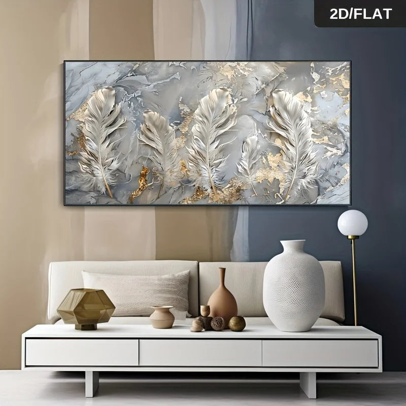 A large rectangular wall art piece featuring three large white feathers over a gray and white marble-like background with gold leaf accents, displayed above a modern white sofa in a styled living room. A small '2D/FLAT' label appears in the top-right corner.