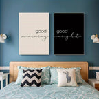 Bedroom with 'good morning' and 'good night' wall art above a bed.