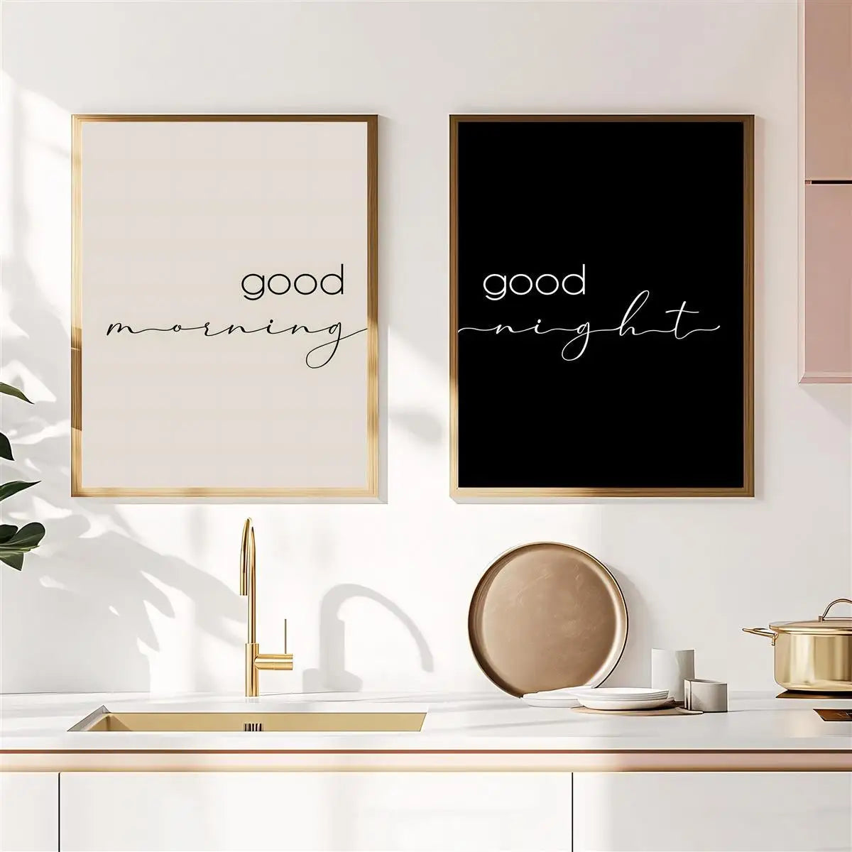 Two framed prints on a kitchen wall, one saying 'good morning' and the other 'good night'.