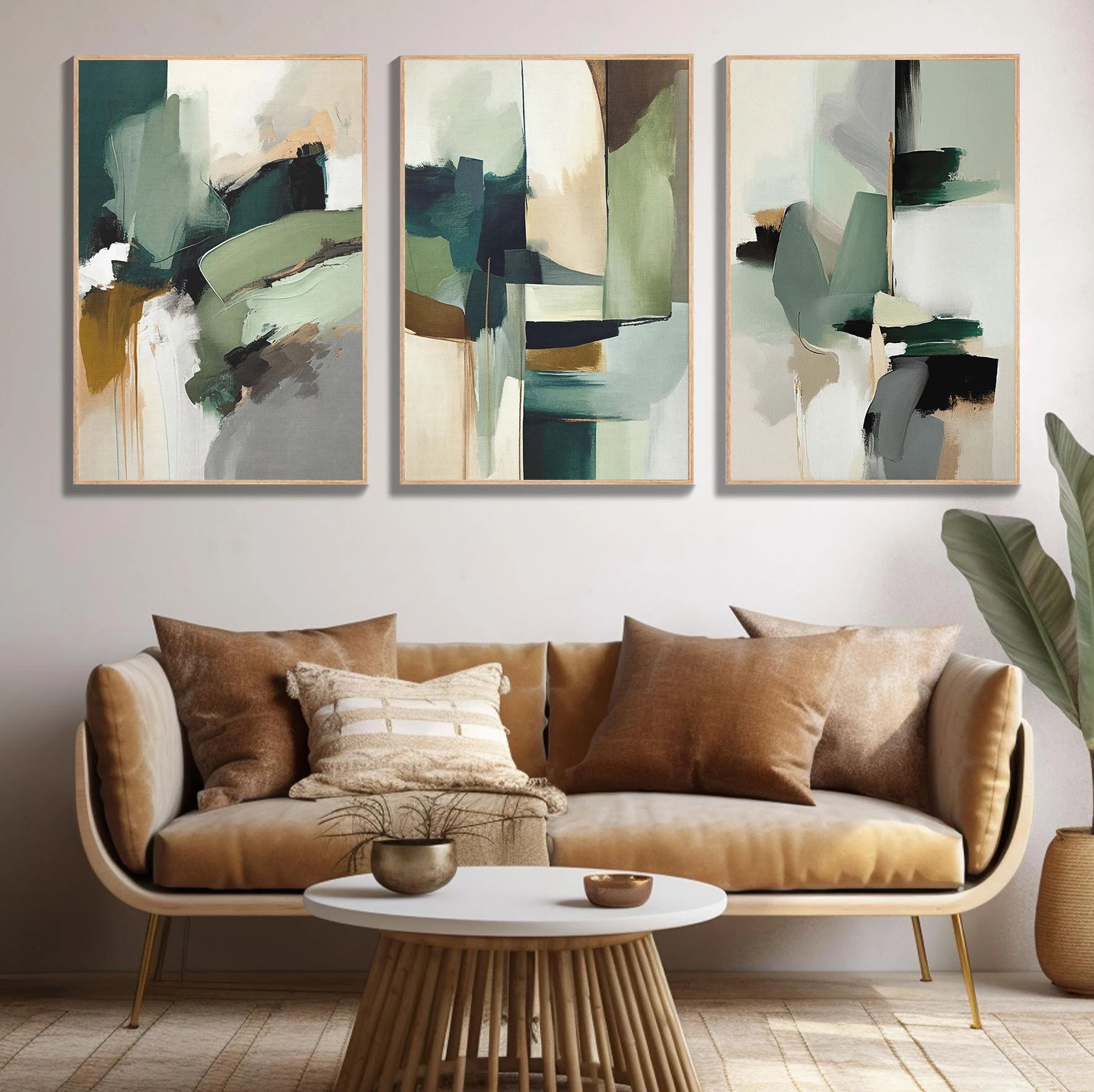 Three abstract art pieces above a brown sofa in a living room setting.