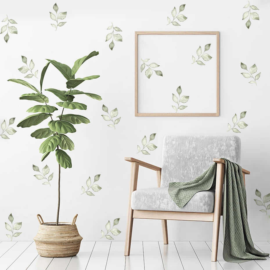 Room interior with a plant, chair, and wall art on a light-colored floor and wall.
