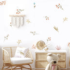 Nursery room with wicker crib, teddy bear, and decorative wall elements.