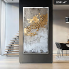 Abstract art piece with gold and gray colors on a wall in a modern interior setting.