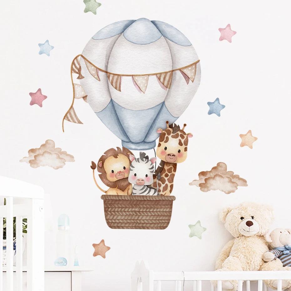Wall decal of animals in a hot air balloon with teddy bear and stars on a wall.