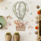 Wall decal of animals in a hot air balloon on a wall with decorative elements.