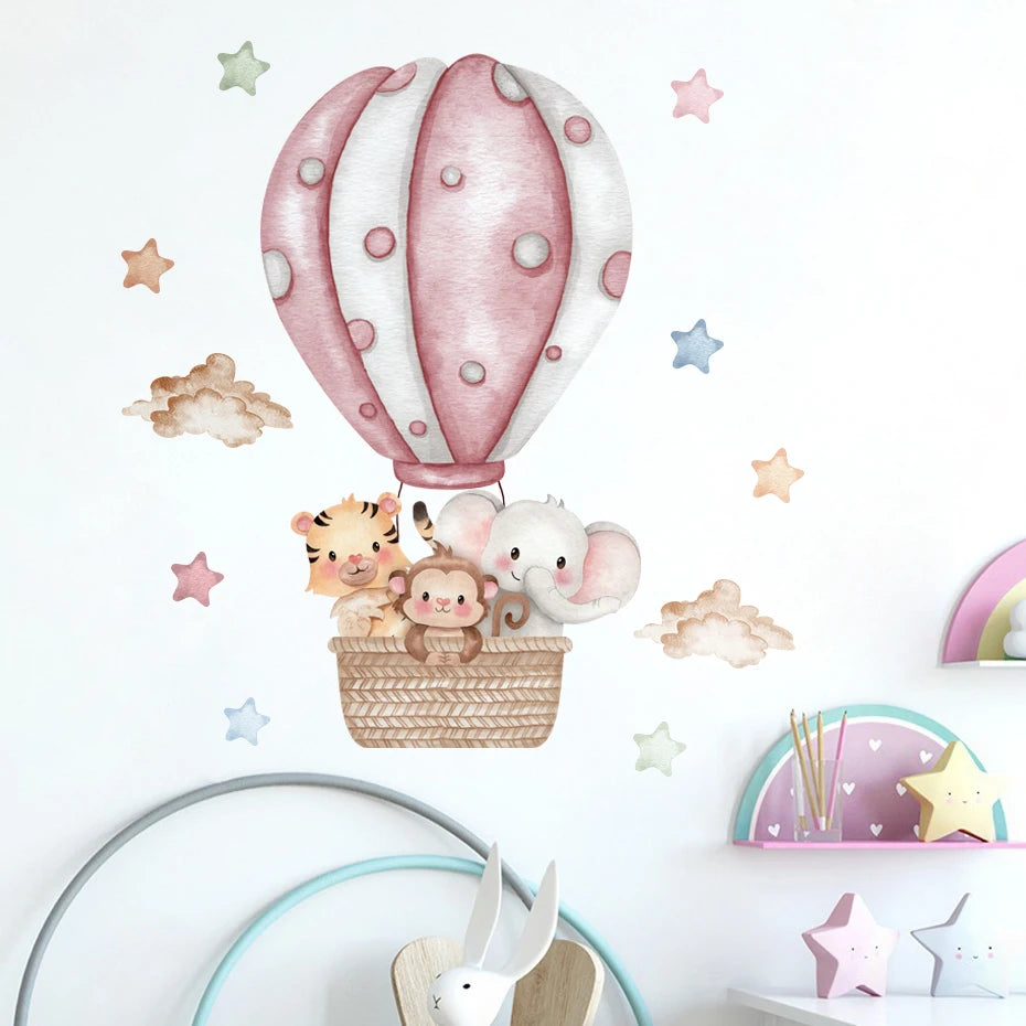 Wall decal of a pink hot air balloon with animals on a white wall.