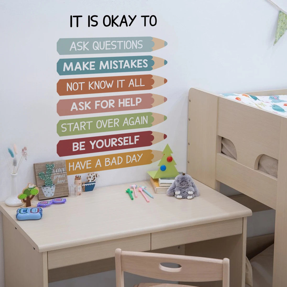 Children's desk with motivational wall decal in a room setting