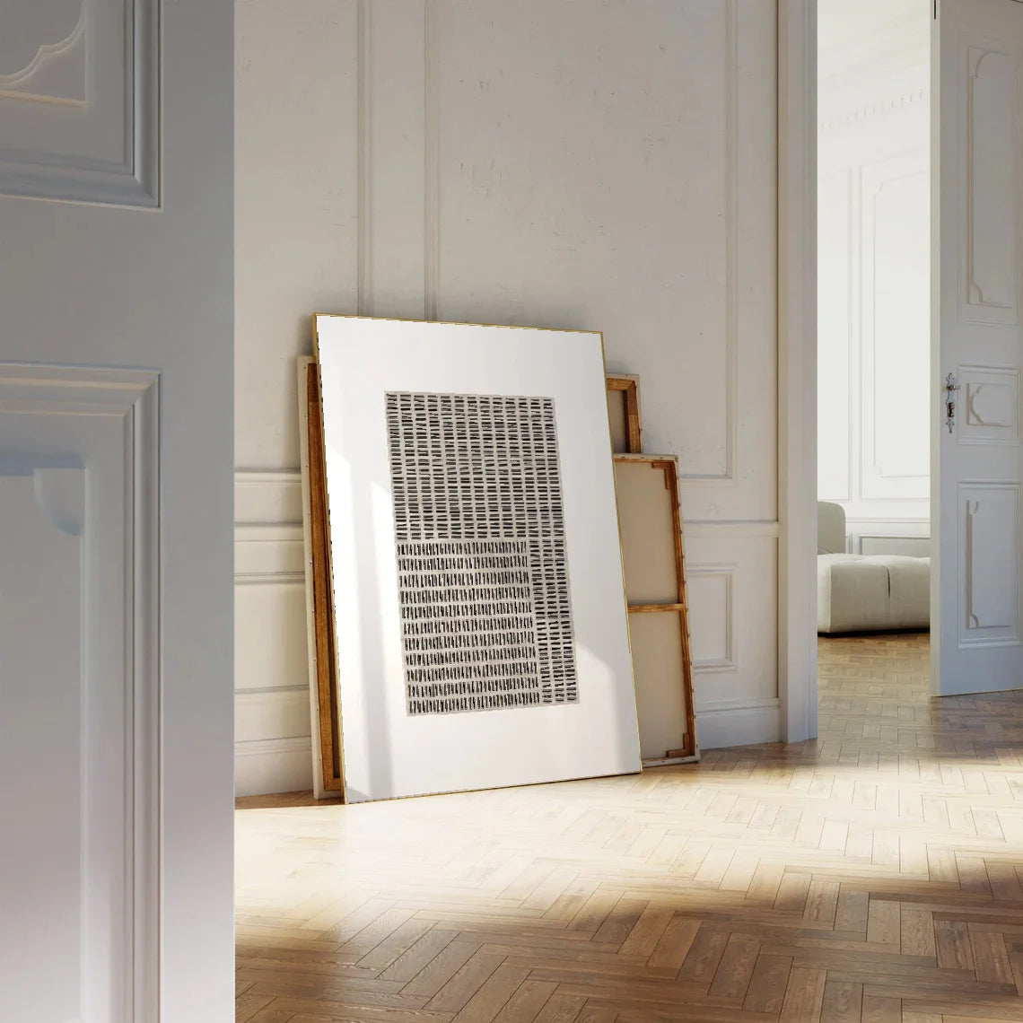 Framed artwork on a wall in a room with wooden flooring