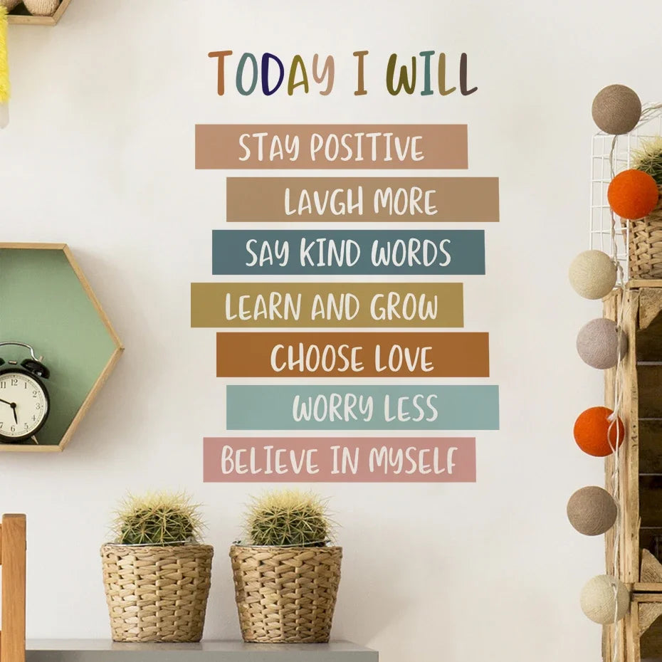 Motivational wall quote with colorful text on a white wall, surrounded by decorative items.