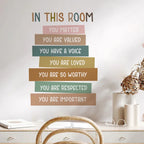 Decorative wall quote in a home office setting with motivational text.