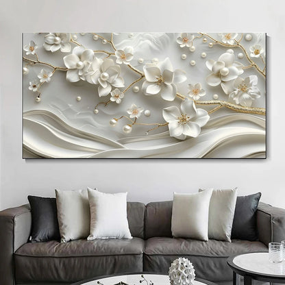 Decorative wall art with floral design above a gray sofa with patterned cushions.